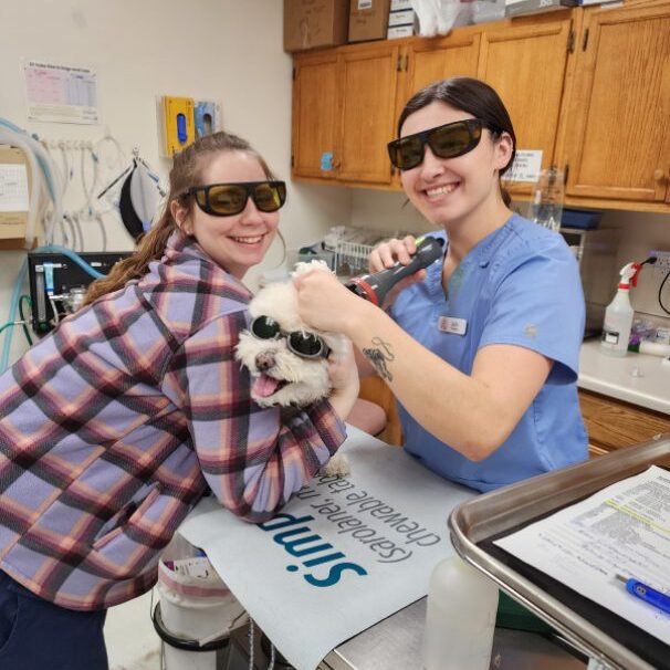 2-girls-an-a-dog-wearing-glasses